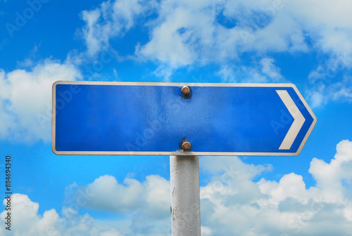 Road signs, billboards, traffic signs, no text. Background is sky.