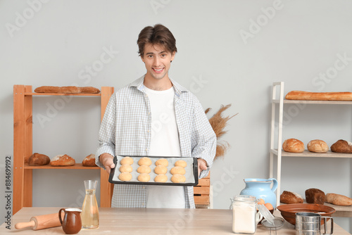 Handsome young man holding ...