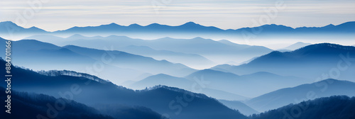 Blue Monochromatic Wonder: Spectacular Cascade of Foggy Mountains under Overcast sky © Richard