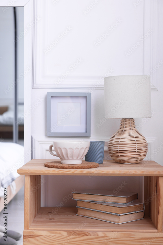 Obraz premium Stylish living room interior with bed, bedside table and lamp