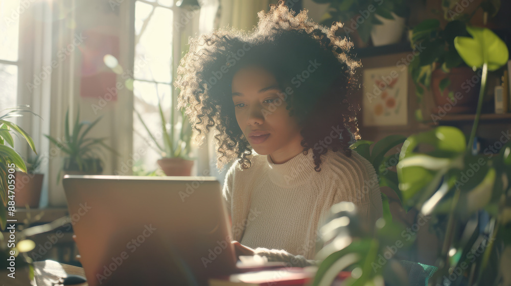 A photograph of a woman working on a laptop, with curly hair and a focused expression, in a minimalist home office A photograph of a woman working on a laptop, with curly hair and a focused expression, in a minimalist home office