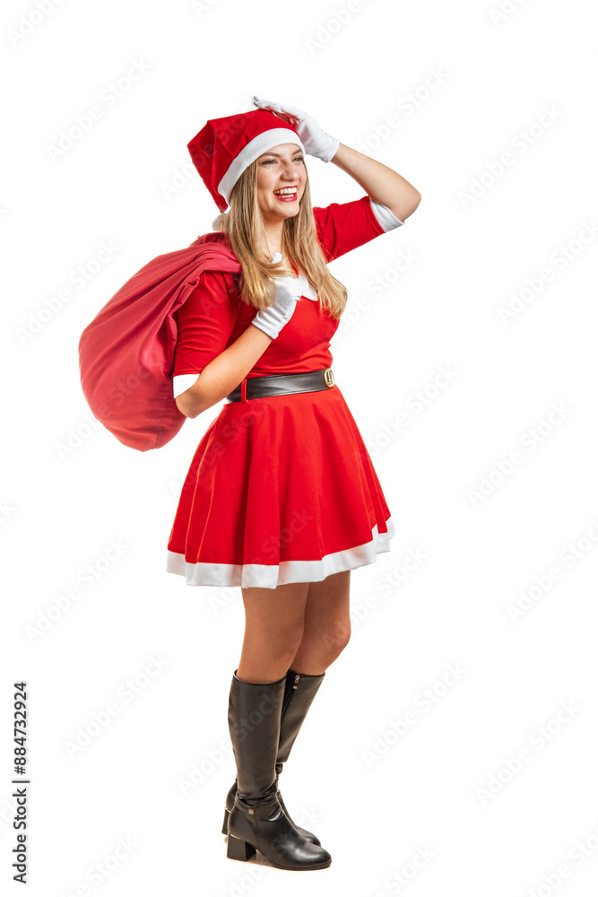 Young Santa Claus smiling in his red suit and a gift bag on white background Young Santa Claus smiling in his red suit and a gift bag on white background
