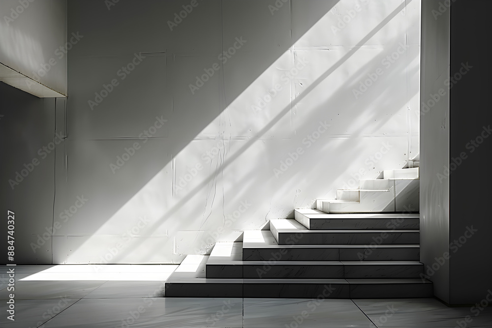 Fototapeta premium Sunlight streaming onto modern minimalist stairs, creating a serene and contemplative atmosphere. Ideal for architectural firms, interior decor, and creative projects.