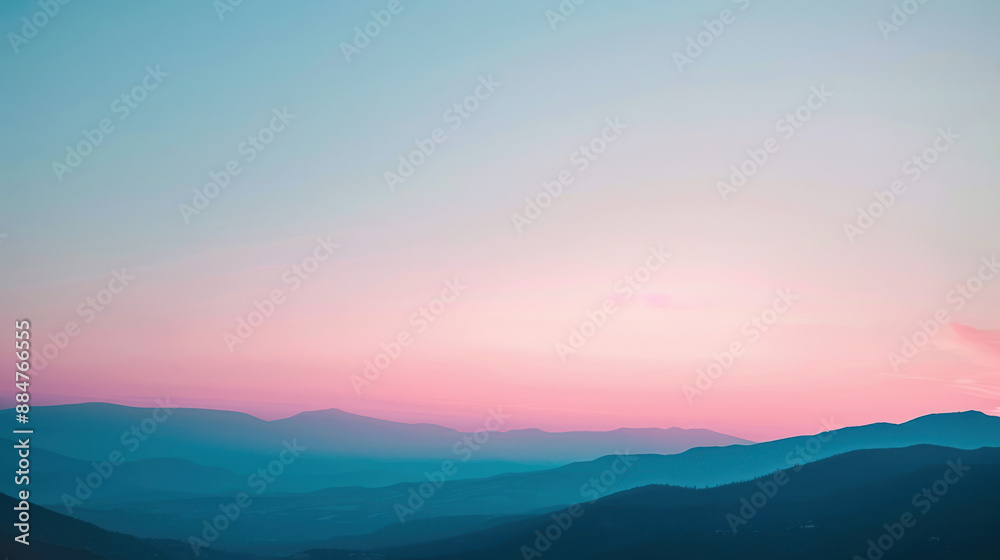 Fototapeta premium A photograph of a frosty mountain range at dawn, light pink and blue sky, sharp peaks, serene and majestic setting