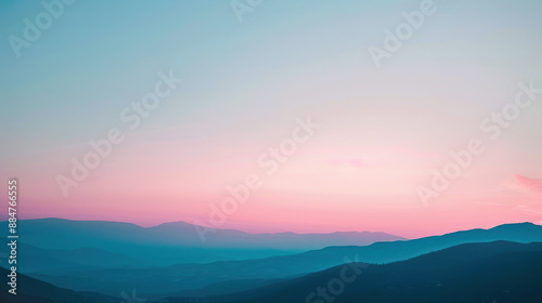 A photograph of a frosty mountain range at dawn, light pink and blue sky, sharp peaks, serene and majestic setting © otter2