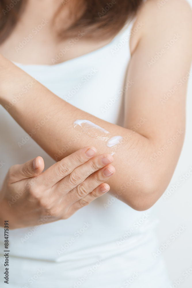 Skin care lotion and Skin body cream Moisturizing, Sunscreen and Healthy Daily Routine concepts. Beauty Woman applying moisturizing skincare cream on arm and body at home Skin care lotion and Skin body cream Moisturizing, Sunscreen and Healthy Daily Routine concepts. Beauty Woman applying moisturizing skincare cream on arm and body at home