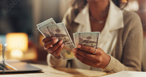 Hands, home and counting cash for budget, savings or profit from trading with laptop in night. Person, money and planning for investment, bills or payment with dollar, decision and computer in house