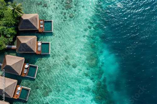 Aerial view of the luxury tropical island resort, which blends the Maldives resort's bungalow with the clear sea photo