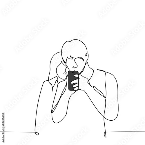 man stands immersed in the screen of his phone and a woman peeks from behind - one line art vector. concept of peeking into someone else's phone, spying and checking your partner