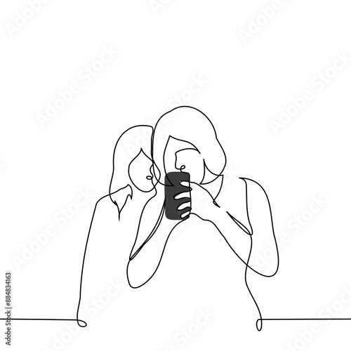 woman stands immersed in the screen of her phone and another peeks from behind - one line art vector. concept peeking into someone else's phone, curiosity