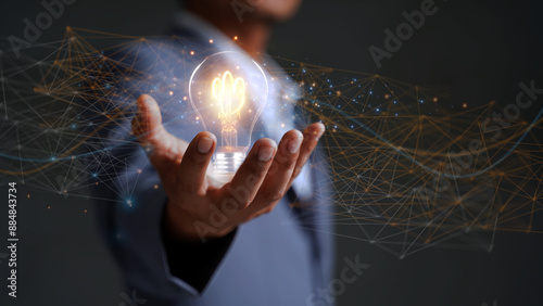 Solution or creative idea for designing a web banner or landing page for an innovative company with a hand sticking out of the screen with a light bulb. Famous abstract geometric shapes and lead lines