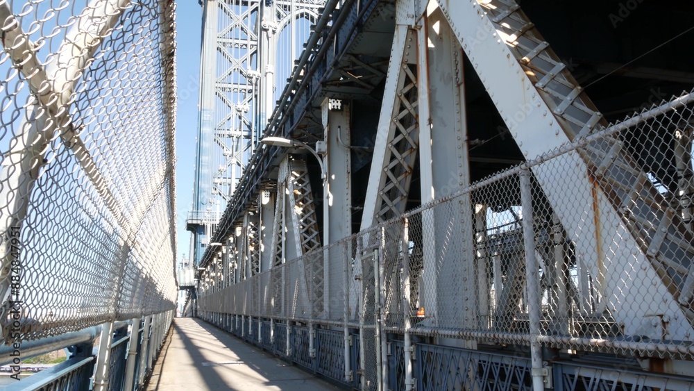Obraz premium Manhattan Bridge to Brooklyn Dumbo. New York City symbol, USA travel destination. Architecture of United States, tourist landmark. Cable-stayed bridge. Pedestrian path perspective.