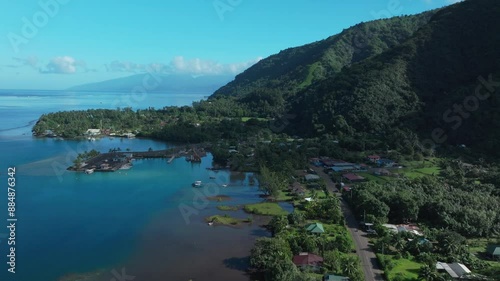 Teahupoo Tahiti French Polynesia aerial drone view road streets up island coast to Papeete morning sunny sunshine bay channel coral reef mountainside car traffic jeep roadtrip drive forward motion photo