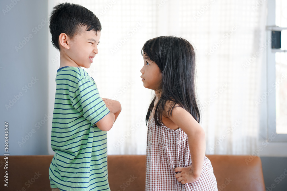 Upset brother and sister on sofa at home Upset brother and sister on sofa at home