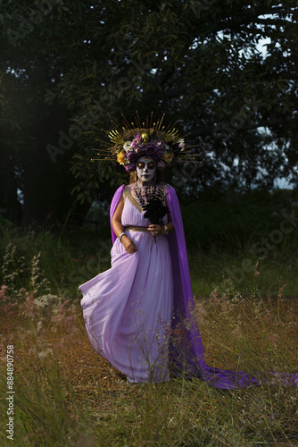 Outdoor portrait of a woman dressed as a catrina. Day of the dead and halloween celebration.