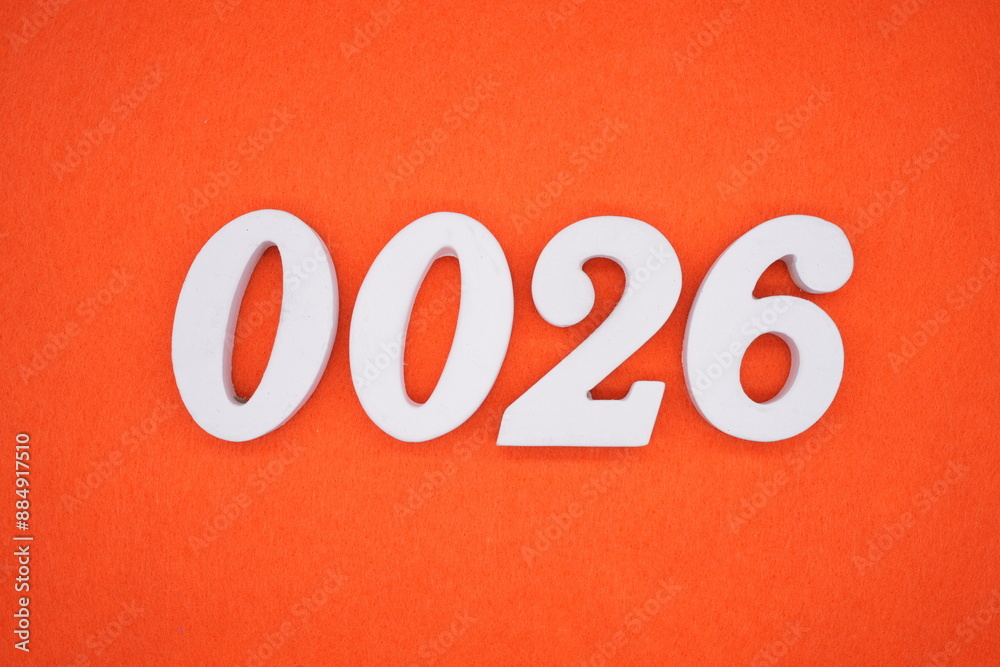The numbers are made of white painted wood. Placed on the floor was orange paper. The numbers are made of white painted wood. Placed on the floor was orange paper.