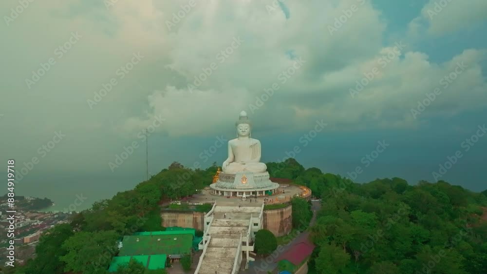 An aerial view of the Phuket Big Buddha surrounded by white clouds in a blue sky.
clouds are moving slowly in the beautiful sky at sunrise. 360 degree view on Phuket big Buddha viewpoint An aerial view of the Phuket Big Buddha surrounded by white clouds in a blue sky.
clouds are moving slowly in the beautiful sky at sunrise. 360 degree view on Phuket big Buddha viewpoint