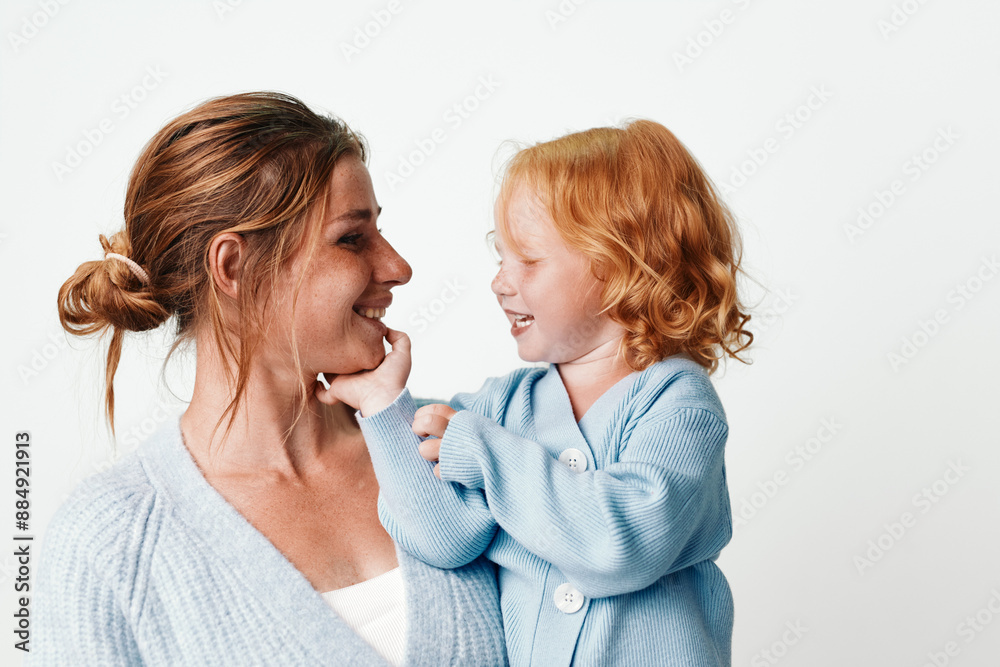 Mother and daughter smiling together during a family vacation in a tropical paradisedestination Mother and daughter smiling together during a family vacation in a tropical paradisedestination