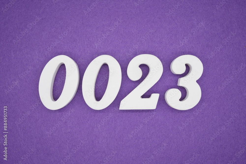 The numbers are made of white paint wood, placed on the background as a purple paper. The numbers are made of white paint wood, placed on the background as a purple paper.