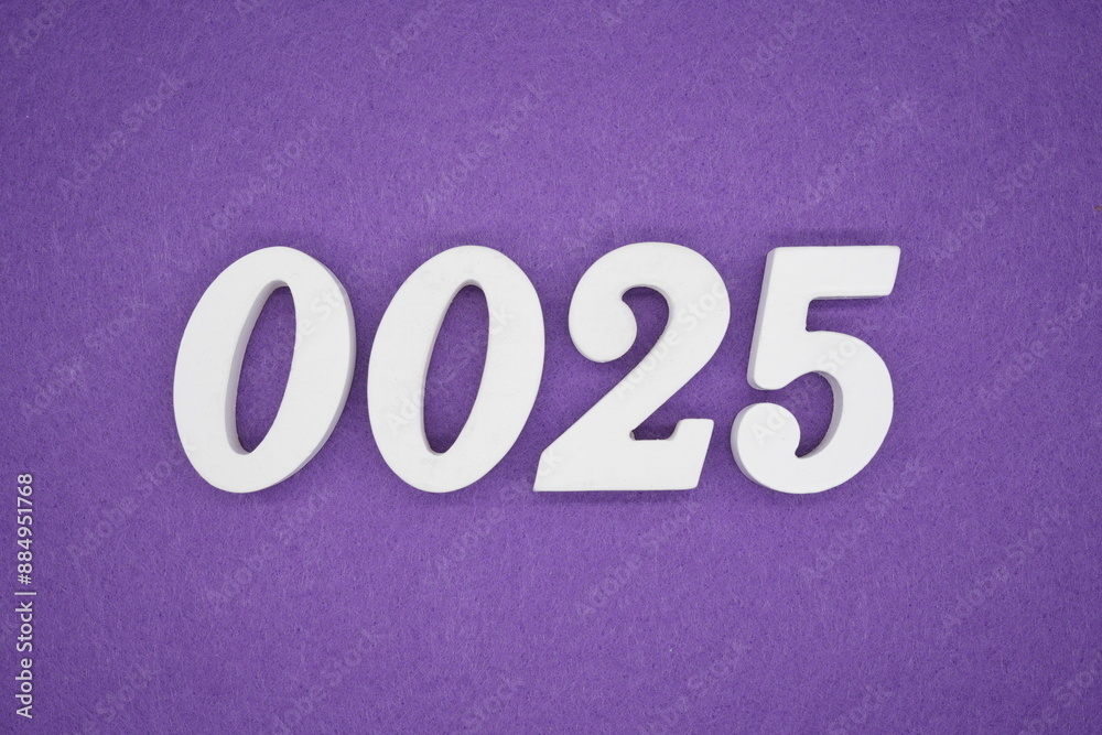 The numbers are made of white paint wood, placed on the background as a purple paper. The numbers are made of white paint wood, placed on the background as a purple paper.
