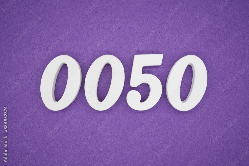 The numbers are made of white paint wood, placed on the background as a purple paper. The numbers are made of white paint wood, placed on the background as a purple paper.