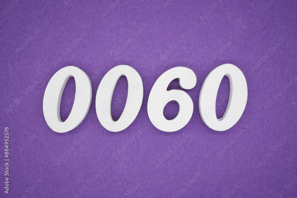 The numbers are made of white paint wood, placed on the background as a purple paper. The numbers are made of white paint wood, placed on the background as a purple paper.