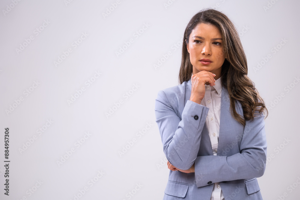 Portrait of pensive businesswoman who is looking away and thinking. Portrait of pensive businesswoman who is looking away and thinking.