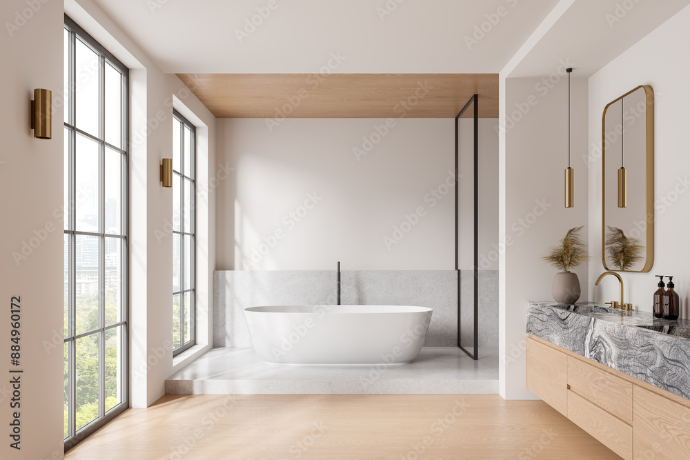 Fototapeta premium Cozy hotel bathroom interior with tub, sink and accessories, panoramic window