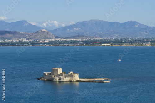 Nafplio, Greece - August 11, 2023: Aerial view of ruins and rampart of Bourtzi Castle on the sea
 photo