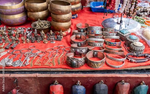 beautiful handcrafted tibetan silver bracelets, singing bowls and keychains sold at street gift store