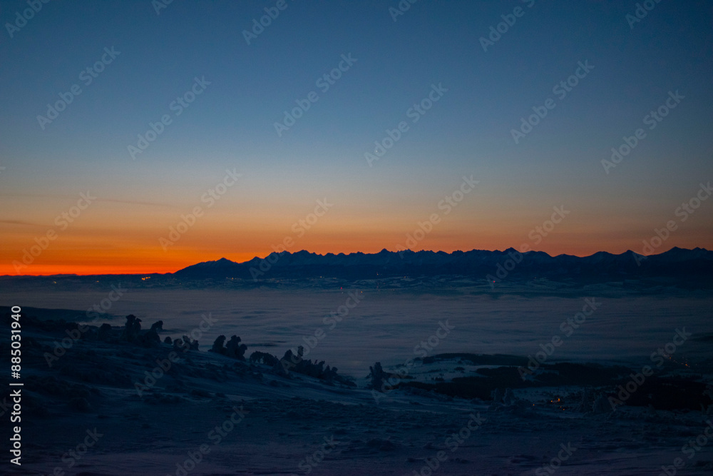 sunrise over the Tatra Mountains and snowy mountain peaks