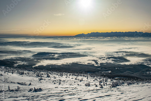 sunrise over the Tatra Mountains and snowy mountain peaks photo