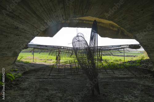 Daejeong-eup, Seogwipo-si, Jeju-do, South Korea - October 18, 2015: Interior of a wire model airplane in concrete hangar built by Japan army during World War II at Altre Airfield
 photo