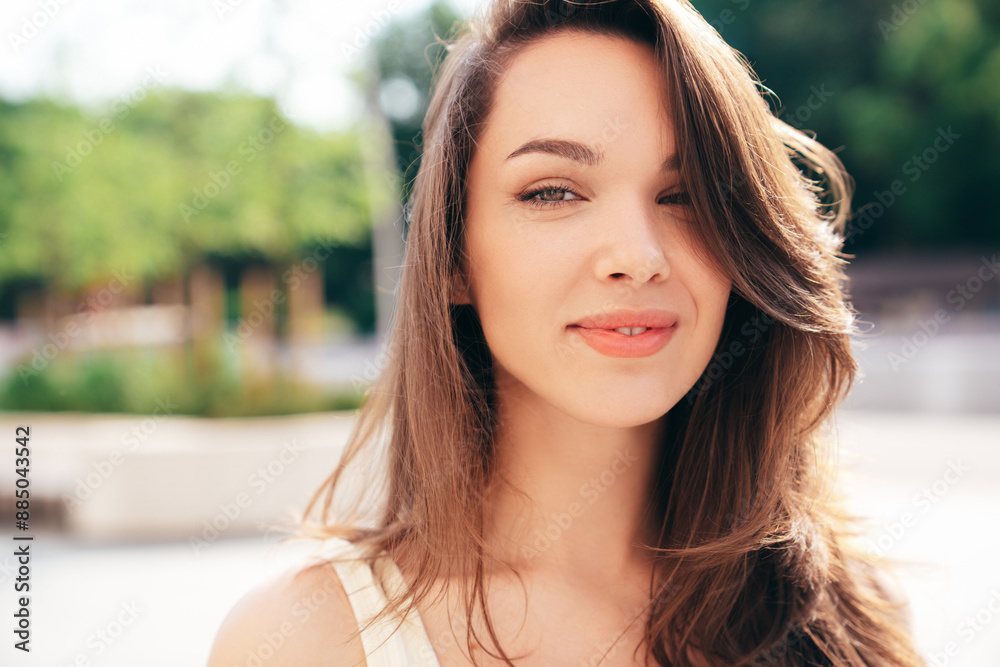 Closeup portrait of young beautiful smiling woman in trendy. Sexy carefree model posing on the street background at sunset. Positive female. Cheerful and happy. Outdoors at sunny day Closeup portrait of young beautiful smiling woman in trendy. Sexy carefree model posing on the street background at sunset. Positive female. Cheerful and happy. Outdoors at sunny day