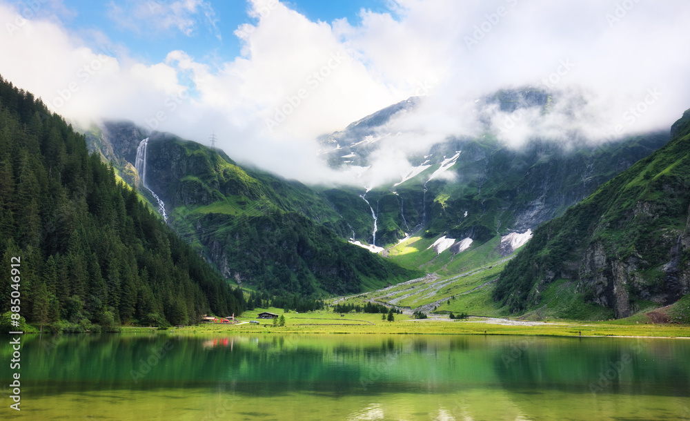 Beautiful green lake in Mountain Alps landscape, Austria - natural landmark Hintersee in the Felber valley near Mittersill at the core zone of the national park High Tauern, Salzburg, Austria Beautiful green lake in Mountain Alps landscape, Austria - natural landmark Hintersee in the Felber valley near Mittersill at the core zone of the national park High Tauern, Salzburg, Austria