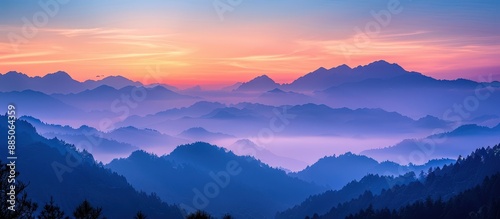 Stunning Sunrise Over Misty Mountain Range with Vibrant Colors and Serene Atmosphere