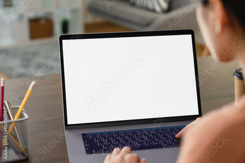 Woman hand using laptop and type on the keyboard, Mockup screen of advertisement.