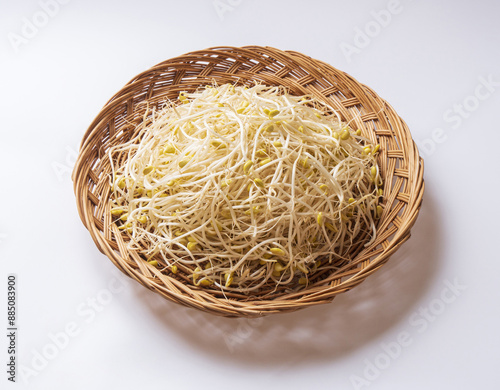 Close-up of stacked raw bean sprouts on bamboo basket white floor, South Korea 