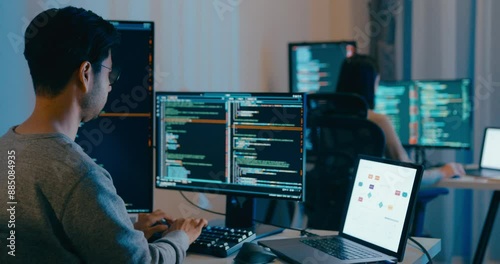 Group Adult Asia male, female freelance typing write prompt AI bot IT app smart program nomad, video game, terminal with coding language, designer, big data center on desktop computer in night office.