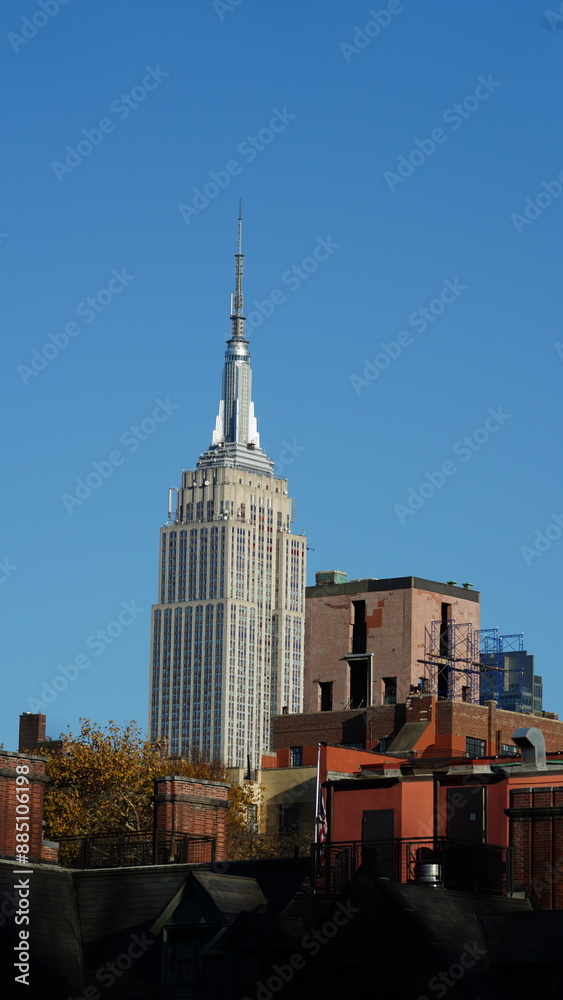 Fototapeta premium The New York city view with the skyscrapers and old buildings as background