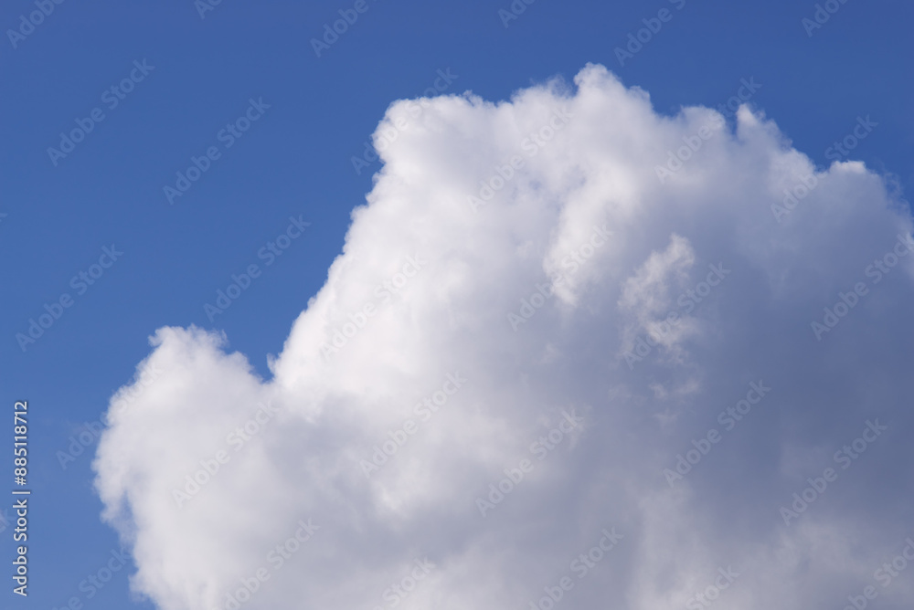 white clouds against a blue sky on a sunny day white clouds against a blue sky on a sunny day