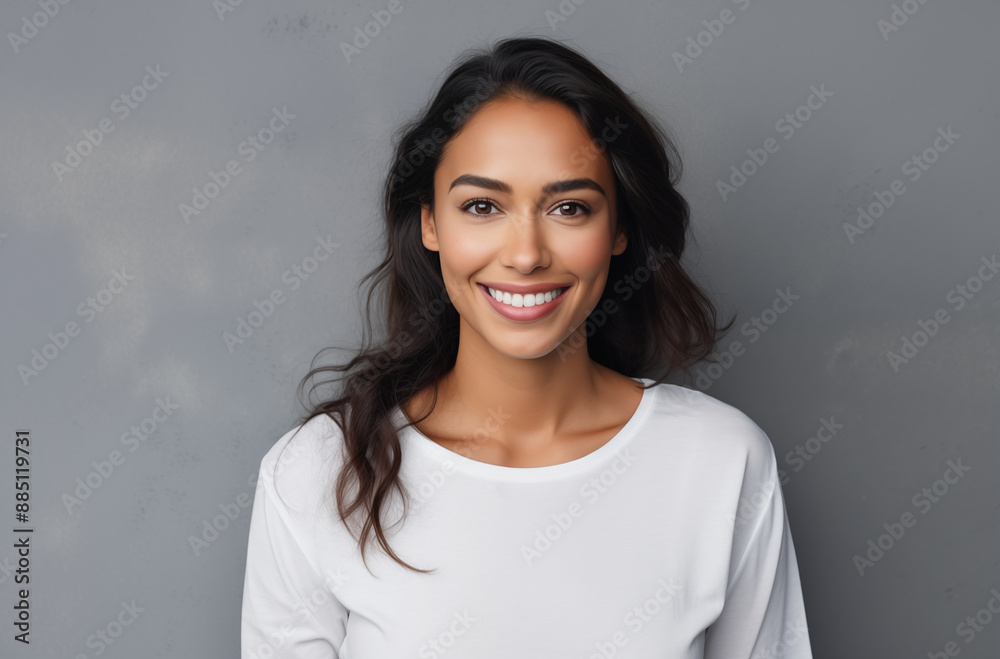 Beautiful Young Woman With Long Dark Hair Smiling In Front Of A Gray Background Wearing A White Shirt Beautiful Young Woman With Long Dark Hair Smiling In Front Of A Gray Background Wearing A White Shirt