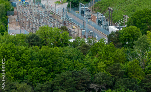 a small electricity substation in the UK set amongst trees