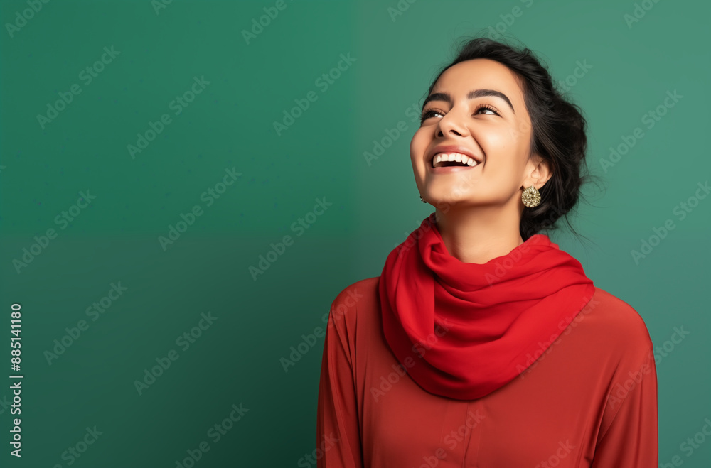 Young Woman with Red Scarf and Earrings Smiling Brightly Against Green Background Showing Joy and Confidence Young Woman with Red Scarf and Earrings Smiling Brightly Against Green Background Showing Joy and Confidence