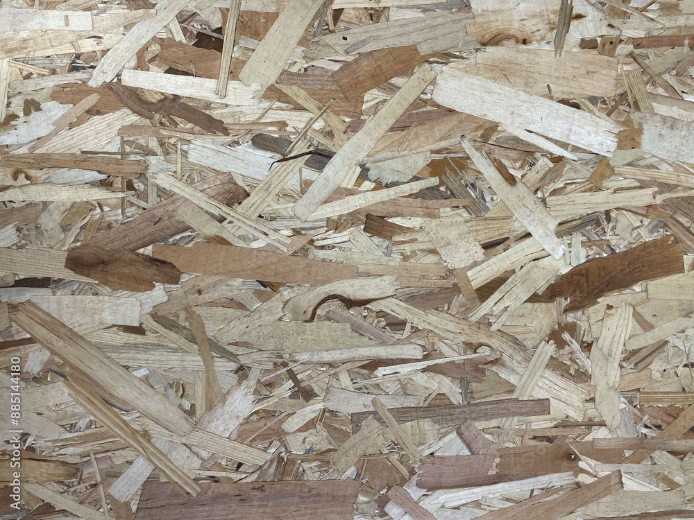 Texture of old rough OSB surface, closeup as grunge background. Gray weathered chipboard. Aged by environment Oriented Strand Board, recycled wood fibers panel, made of pressed wooden chips. Texture of old rough OSB surface, closeup as grunge background. Gray weathered chipboard. Aged by environment Oriented Strand Board, recycled wood fibers panel, made of pressed wooden chips.