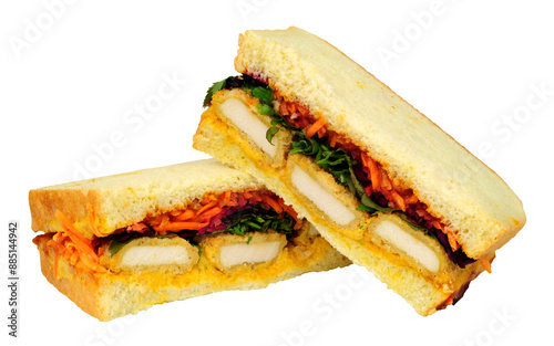 katsu sando sandwiches, filled with panko breaded chicken, katsu mayo and pickled cabbage isolated on a white background photo