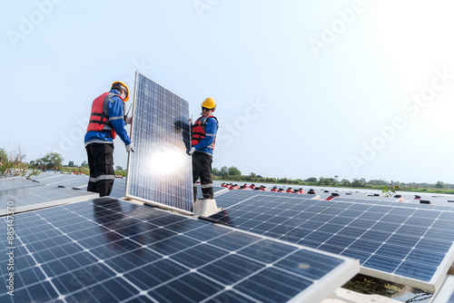 Wallpaper Mural Photovoltaic engineers work on floating photovoltaics. workers Inspect and repair the solar panel equipment floating on water. Engineer working setup Floating solar panels Platform system on the lake. Torontodigital.ca