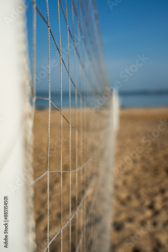 Volleyball net on the lake beach. Volleyball court on the beach