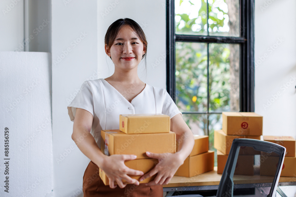 Portrait business woman smile and use tablet checking information on parcel shipping box before send to customer. Entrepreneur small business working at home. SME business online marketing.
Portrait business woman smile and use tablet checking information on parcel shipping box before send to customer. Entrepreneur small business working at home. SME business online marketing.
