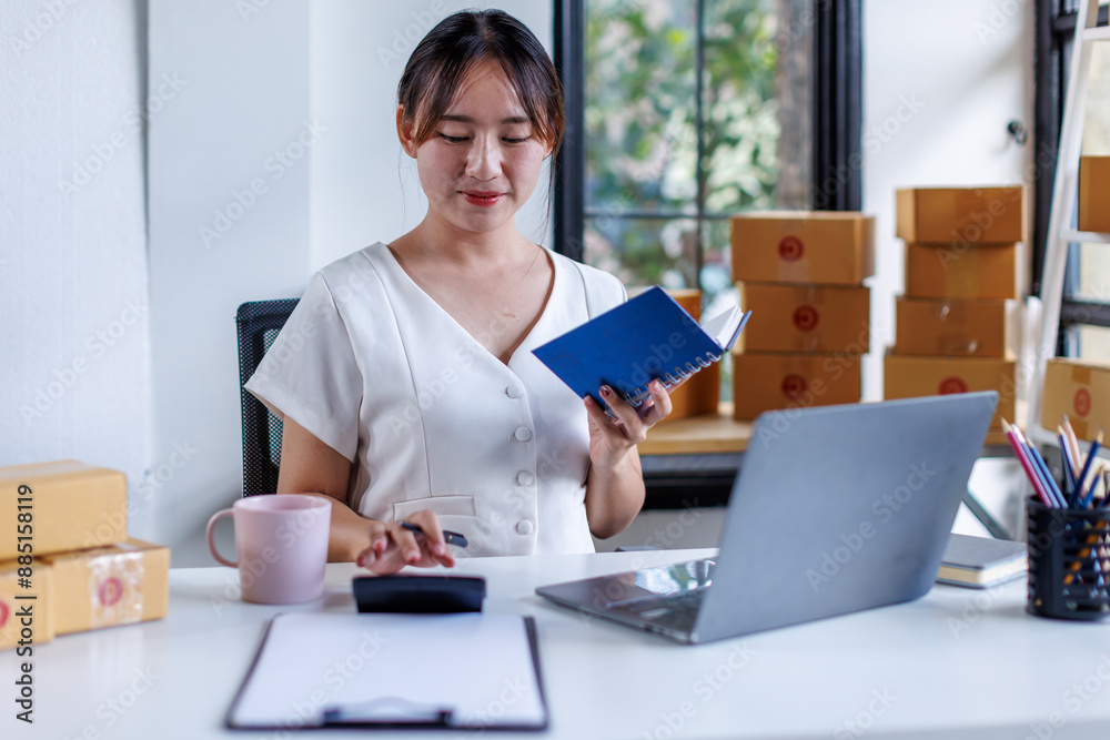 Portrait business woman smile and use tablet checking information on parcel shipping box before send to customer. Entrepreneur small business working at home. SME business online marketing.
Portrait business woman smile and use tablet checking information on parcel shipping box before send to customer. Entrepreneur small business working at home. SME business online marketing.